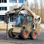 Аренда погрузчика с гидробуром, буром шнекововым фото