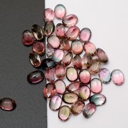 Турмалин - розовые, красные, синие, зеленые, желтые, коричневые камни множества оттенков фото