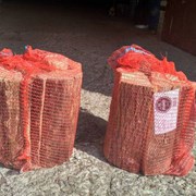 Дрова в сетках фруктовые для мангала, бани, камина фото