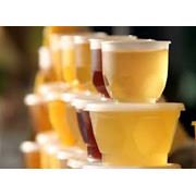 Упаковка мёда в пластиковые стаканчики по 20 150250 и400гр. фото