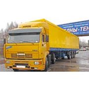 Доставка грузов двумя автомобилями КАМАЗ с бортовыми прицепами до 26 т грузоподъемностью каждый фотография