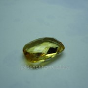 Камень подарочный Цитрин желтый овальной формы граненный двухстороний 13мм на 10мм высотой 4мм весом 4,9карат фото