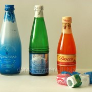 Термоусадочные колпачки на бутылки с пивом и лимонадом фото