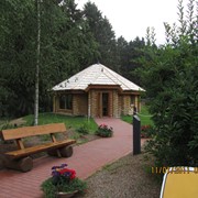 Дом деревянный из круглого леса фото