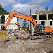 Аренда дорожной техники экскаватора с гидромолотом фото