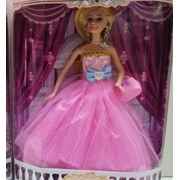 Нарядная кукла в розовом платье с бантом фото