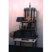 Автомат розлива в бутылки Ж7-ДНП-3 емкостью 005л 001л 025л 05л 07л 10л любой конфигурации призв-ть 3000 б/час фото