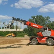 Самоходный многофункциональный телескопический погрузчик - MANITOU MRT 25-40 фотография