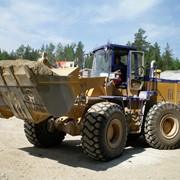 Услуги фронтальных погрузчиков Казахстан фото