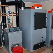 Отопление на твердотопливных котлах. Монтаж систем отопления от профессионалов. фото