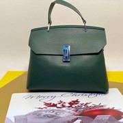 Сумка-клатч зеленая с поворотным замком фото