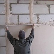 Оштукатуривание стен по маякам фотография