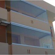Панорамное остекление балкона раздвижными панелями фото