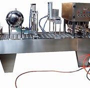 Интегрированная машина для фасовки жидких продуктов ( сметана, йогурт ) в стаканы ф75мм и ф95мм и запайки платинки