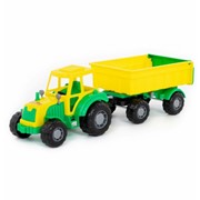 Игрушка трактор с прицепом желтый фотография