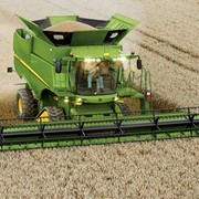 Збирання урожаю зернозбиральними комбайнами Джон Дир фото